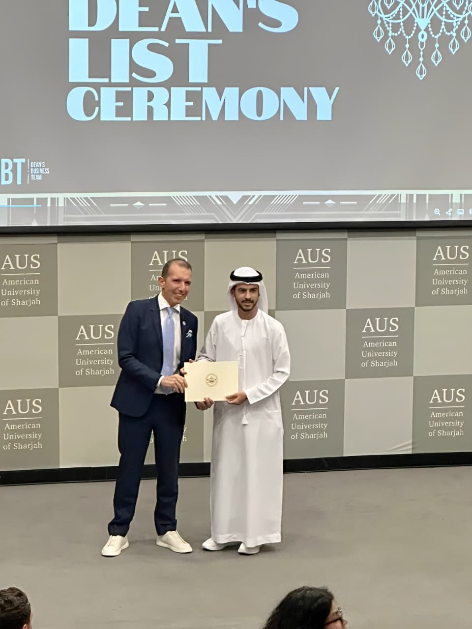 Haitham Alkindi receiving a Dean's List award at the American University of Sharjah