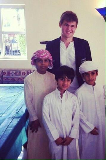 Haitham Alkindi with world chess champion Magnus Carlsen, around 2012